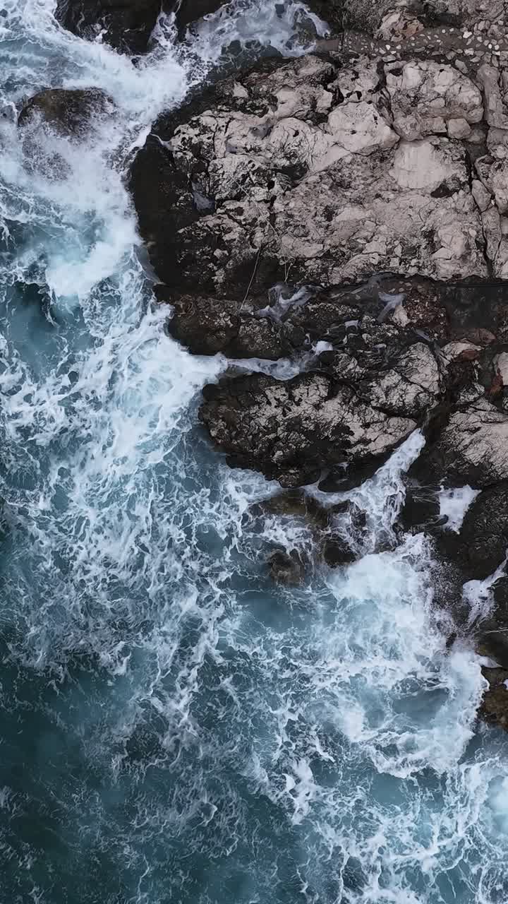 Waves breaking on the rocky coast of Hvar, seen from above