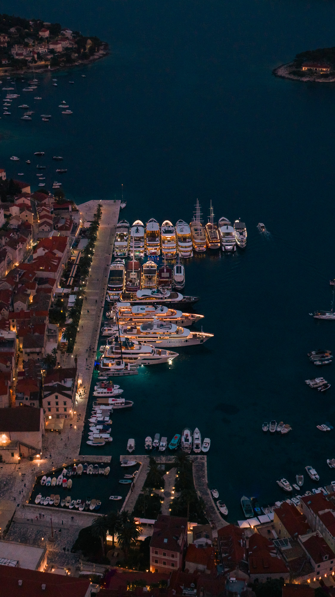 Hvar town at sunset from drone - Spanjola fortress and harbour aerial view